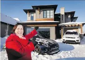  ?? LYLE ASPINALL ?? Jill Olynyk, CEO of Calgary Health Trust, shows off the new Foothills Hospital Home Lottery grand prize show home in Cranston on Wednesday.