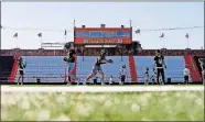  ?? [BRYAN TERRY/ THE OKLAHOMAN] ?? Pawhuska players take the field for football practice.