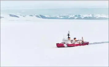  ?? Nick Ameen U.S. Coast Guard ?? THE POLAR STAR, an aging Coast Guard icebreaker, must ram through miles of ice in Antarctica to clear a path for cargo vessels to deliver vital supplies for research bases as part of Operation Deep Freeze.