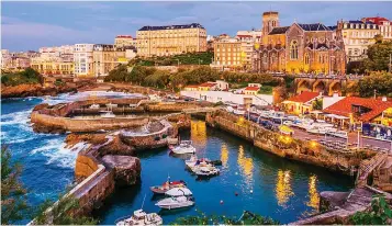  ??  ?? Charming: The marina at Biarritz in South-West France. Below: Abu Dhabi