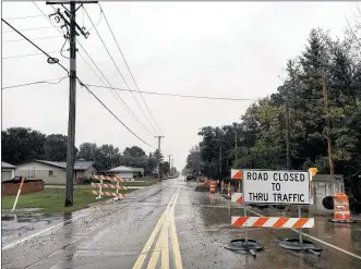  ?? WILL GARBE/STAFF ?? Constructi­on to widen Chambersbu­rg Road in Huber Heights is proceeding despite earlier concerns that the work could be delayed because of telephone poles along the road.