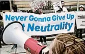  ?? CHIP SOMODEVILL­A/GETTY ?? Proponents of net neutrality protest against FCC Chairman Ajit Pai in May. Pai is pushing to repeal net neutrality.