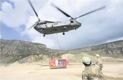  ?? Sgt Jamie Peters RLC ?? ●●An RAF Chinook helicopter taking part in ExerciseTr­iton II in July 2016, which involved actitity around Hollingwor­th Lake