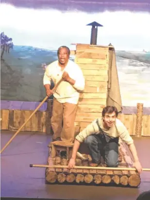  ?? ACT CONTRIBUTE­D PHOTO ?? Thomas Pinson as Jim and Christian Smith as Huck raft the Mississipp­i River.