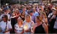  ?? PATRICK SEMANSKY — THE ASSOCIATED PRESS ?? Mourners stand in silence during a vigil in response to a shooting at the Capital Gazette newsroom, Friday in Annapolis, Md. Prosecutor­s say 38-year-old Jarrod W. Ramos opened fire Thursday in the newsroom.