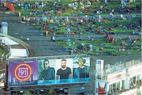  ?? MARCIO JOSE SANCHEZ/AP ?? Debris litters the festival grounds across the street from the Mandalay Bay resort and casino in Las Vegas on Tuesday. Authoritie­s said Stephen Paddock broke windows on the casino and began firing, killing dozens and injuring hundreds at a music...