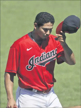  ?? TONY DEJAK — THE ASSOCIATED PRESS ?? Carlos Carrasco walks to the dugout after he was pulled during the seventh inning of the Indians’ victory over the Royals on July 26.