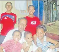  ?? Picture: SUPPLIED ?? Left: Anthony Wai Wong (middle) surrounded by his grandchild­ren in their home in Raiwaqa.