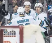  ?? DARRYL DYCK — THE CANADIAN PRESS VIA AP ?? The Sharks’ Tomas Hertl, Logan Couture, right, and Mikkel Boedker celebrate Couture’s goal in a 5-3win over the Vancouver Canucks on Saturday night.