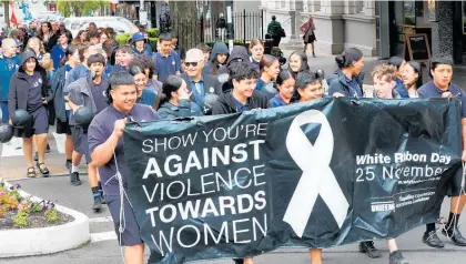  ?? Photo / Bevan Conley ?? Students, community groups, organisati­ons and members of the public marched up Victoria Ave to celebrate White Ribbon Day in Whanganui.