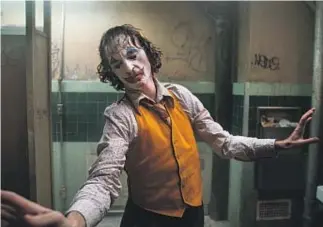  ?? Niko Tavernise Warner Bros. ?? “IT’S BEEN SUPER interestin­g how people react to the movie,” says Joaquin Phoenix, who portrays the nefarious Arthur Fleck in “Joker.”
