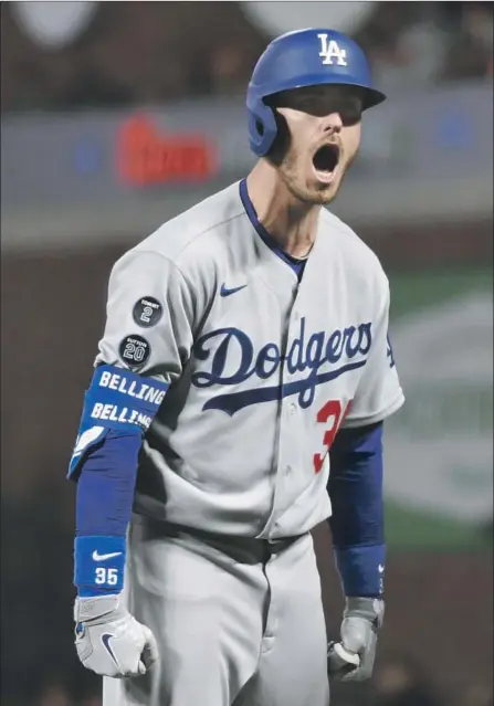  ?? Wally Skalij Los Angeles Times ?? CODY BELLINGER yells to the dugout after hitting the go-ahead RBI single during the ninth inning in Game 5 of the division series.