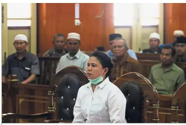  ?? — Reuters ?? Eye of the storm: Meiliana attending a court hearing in Medan.