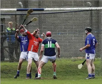  ??  ?? The moment a high ball is spilled at the feet of Bray’s Padraig Doyle who fired home to the back of the net.