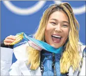  ??  ?? Chloe Kim on the podium during the medal ceremony.