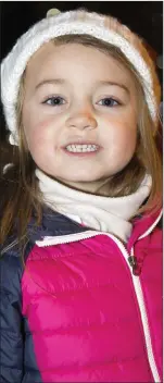  ??  ?? Mia Kennedy wrapped up against the cold at the switching on of the Christmas tree lights in Roundwood.