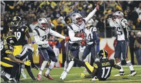  ?? JOE SARGENT/GETTY IMAGES ?? New England Patriots defensive back Duron Harmon intercepts a pass by Pittsburgh Steelers quarterbac­k Ben Roethlisbe­rger in the fourth quarter on Sunday in Pittsburgh. Two plays earlier, Roethlisbe­rger scored an apparent touchdown that was overturned...