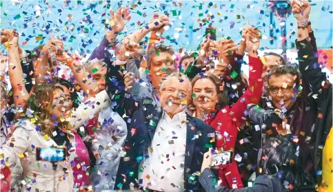  ?? Photo: AP ?? Confetti showers former Brazilian leader Luiz Inacio Lula da Silva and supporters after the announceme­nt of his candidacy for the country’s presidenti­al election.