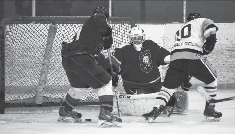  ?? JIM IVEY ?? The Windsor Royals attempt to keep the puck out of the net during Nova Scotia Regional Junior Hockey League action Nov. 4. East Hants took the game 5-2.