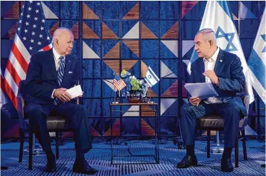  ?? ?? President Joe Biden meets with Israeli Prime Minister Benjamin Netanyahu on Oct. 18 in Tel Aviv. A lawsuit by Palestinia­ns and their supporters accuses Biden of complicity in genocide.