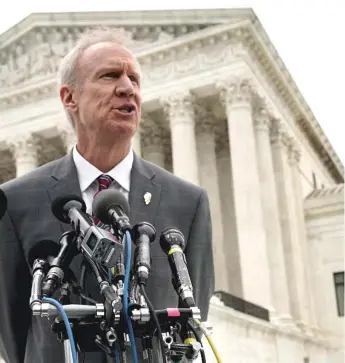  ?? ALEXWONG/ GETTY IMAGES ?? Illinois Gov. Bruce Rauner speaks to reporters in front of the U. S. Supreme Court after a hearing in February in the case of Janus v. AFSCME Council 31.