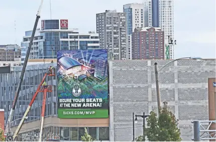  ?? PHOTOS BY MICHAEL SEARS/MILWAUKEE JOURNAL SENTINEL ?? A large LED sign on the northwest corner of the Bucks’ parking facility changes with different messages. The structure, on N. 6th St. between W. McKinley and W. Juneau avenues, has 1,256 spaces and six levels with retail space on the ground floor. See...