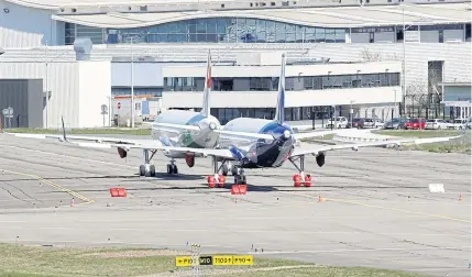  ?? REUTERS ?? Two undelivere­d Airbus A320neo jets are parked at Toulouse Airport, southweste­rn France in this file photo.