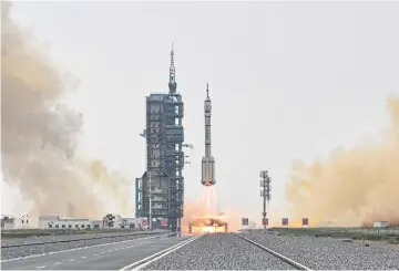  ?? AFP ?? The Long March-2F rocket, carrying the ‘Shenzhou-16’ mission, lifts off from the Jiuquan Satellite Launch Centre in China’s northweste­rn Gansu province yesterday.