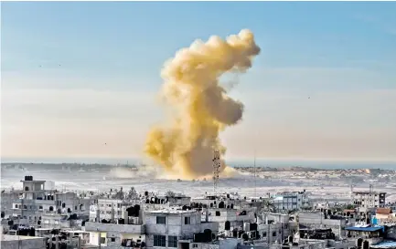  ??  ?? Smoke rises following an explosion close to the Egyptian side of the Rafah border on Tuesday. (AFP)