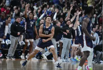  ?? MICHAEL CONROY — THE ASSOCIATED PRESS ?? Fairleigh Dickinson guard Grant Singleton (4) celebrates after a basket against Purdue in the second half of a firstround game in the NCAA Tournament in Columbus, Ohio, on Friday.