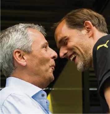  ?? KEY ?? Wiedersehe­n in der Champions League: Dortmunds Lucien Favre (l.) und PSG-Trainer Thomas Tuchel.