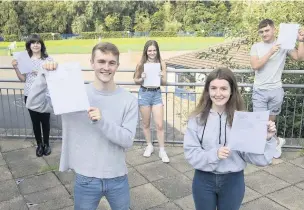  ??  ?? Some of the Alder Grange Sixth Formers with their results