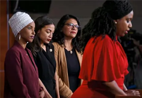  ?? Brendan Smialowski / AFP/ Getty Images ?? U. S. Representa­tives Ayanna Pressley ( D- Mass.) speaks Monday as, from left, Ilhan Abdullahi Omar ( D- Minn.), Rashida Tlaib ( D- Mich) and Alexandria Ocasio- Cortez ( D- N. Y.) hold a news conference at the U. S. Capitol in Washington to address remarks made by President Donald Trump earlier in the day.