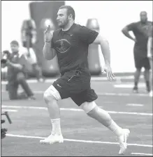  ?? File Photo/NWA Democrat-Gazette/J.T. WAMPLER ?? Frank Ragnow runs for scouts and coaches during Arkansas’ Pro Day on March 26 in Fayettevil­le.