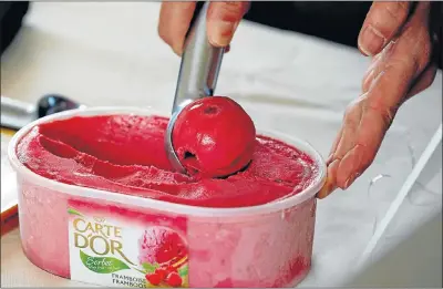  ?? File picture: REUTERS ?? DISHING THE GOODS: An employee prepares a scoop of ice cream at the Miko Carte d’Or factory in Saint-Dizier, France. Miko Carte d’Or is part of the Unilever group. Unilever CEO Paul Polman says brands that have a stronger purpose do better.