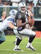  ?? KYLE TERADA/USA TODAY ?? JaMarcus Russell was sacked 70 times, not counting this 2009 preseason drop by Keith Brooking.
