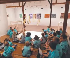  ??  ?? RICH EXPERIENCE: St Andrew's Catholic College Year 3 students looking at the baskets at the Cairns Art Gallery.