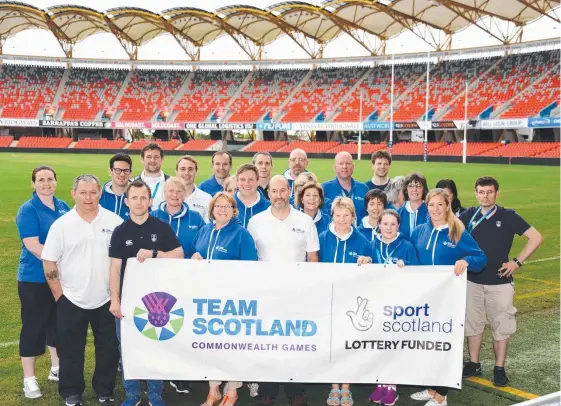  ??  ?? Chef De Mission Jon Doig and team Scotland at Metricon Stadium. The team came to see the Athletes’ Village but weren't allowed in. Picture: STEVE HOLLAND