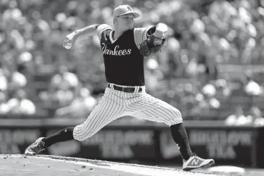  ?? Associated Press ?? n New York Yankees starting pitcher Sonny Gray delivers a pitch during the second inning of a baseball game against the Seattle Mariners on Saturday in New York.