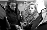  ?? AMMAR AWAD / REUTERS ?? Palestinia­n teen Ahed Tamimi (right) enters a courtroom escorted by Israeli soldiers near Ramallah, Middle East, on Monday.