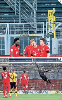  ?? FOTOS: AFP ?? (1) Joshua Kimmich y su moderada celebració­n después del gol de la victoria contra Dortmund. (2) El portero Roman Burki no puede hacer nada. ¿El gol del título?