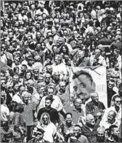  ?? CIRO FUSCO/AP ?? A picture of police officer Mario Cerciello Rega is carried at his funeral in his hometown of Somma Vesuviana.