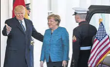  ?? AFP ?? US President Donald Trump greets German Chancellor Angela Merkel at the White House in Washington on Friday.