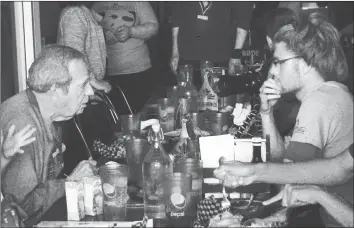  ?? Herald photo by Tim Kalinowski ?? Members of the Fox family meet with members of the Montreal Runners on Saturday at the Coulee Brew Co. The Montreal Runners are doing a relay run across Canada to raise $50,000 for the Terry Fox Foundation. Above, Terry Fox (namesake uncle of the...