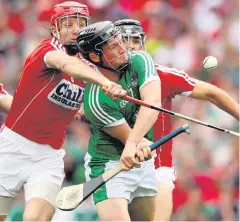  ??  ?? What a match: Limerick’s Peter Casey is blocked by Cork’s Bill Cooper in the All-Ireland semi-final at Croke Park, an encounter hailed as an all-time classic