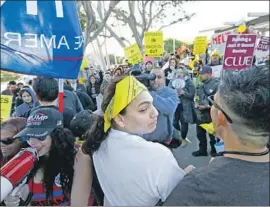  ?? Francine Orr Los Angeles Times ?? PROTESTERS on both sides of the immigratio­n debate rally outside a meeting of the Los Alamitos City Council, which voted to opt out of the state “sanctuary” law.