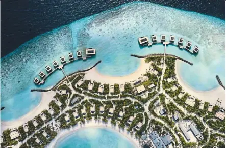  ?? — Patina Maldives/dpa ?? The Patina Maldives resort has a perfect half-moon curve.