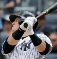  ?? JULIE JACOBSON — THE ASSOCIATED PRESS ?? New York’s Clint Frazier connects for an RBI single against the Cincinnati Reds during the third inning.