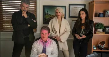  ?? PHOTO COURTESY NETFLIX ?? Pierce Brosnan, Ellen Barkin, Nina Dobrev and Adam Devine in a scene from “The Out-laws.”