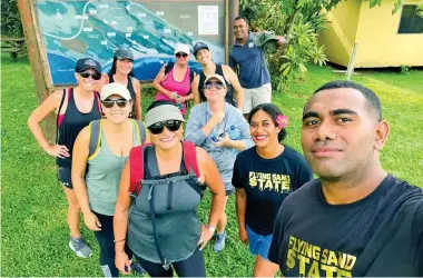  ?? ?? Ranger Viliame on tour duty with a local group from Nadi.